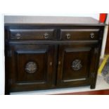 A STAINED OAK ASSISTANT SIDEBOARD