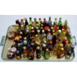 A TRAY WITH 100 VARIOUS ALCOHOL MINIATURES