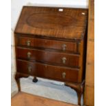 A 29" MAHOGANY WRITING BUREAU OVER 3 DRAWERS ON BALL & CLAW FEET