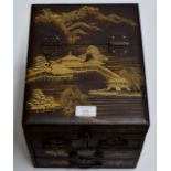 AN ORIENTAL LACQUERED STATIONARY CABINET