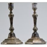 A PAIR OF EARLY 20TH CENTURY STERLING SILVER WEIGHTED CANDLE STICKS WITH BIRMINGHAM ASSAY MARKS,