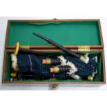 A SET OF OLD BAGPIPES WITH A WOODEN CARRY CASE