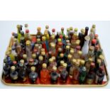 A TRAY WITH 100 VARIOUS ALCOHOL MINIATURES