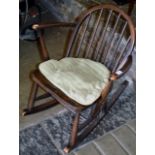 AN ERCOL CHILD SIZE SPAR BACK ROCKING CHAIR