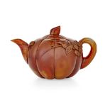 LARGE CARVED AGATE TEAPOT AND COVERof melon form, with the handle carved to imitate a steam