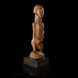 TEKE ANCESTOR FIGURE carved wood, shown naked and holding staff of office, caramel patina, mounted