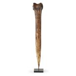 ASMAT BONE DAGGER cassowary bone, with incised stylised decoration, mounted 33cm long