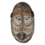 SEPIK GABLE MASK composed of woven rattan cane, red, white and black natural pigments, sago leaf