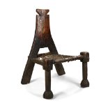 FINE ETHIOPIAN CHAIR carved wood, with woven leather seat and patinated backrest 71cm high