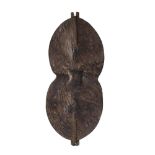 SUKUMA SHIELD hide, with stamped circular decoration and supporting wooden pole on the reverse