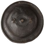 AMHARA SHIELD hide, black leather of convex form with embossed concentric decoration, stitched