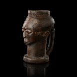 KUBA ANTHROPOMORPHIC CUP carved wood, representing a stylized head with an elaborate coiffure and