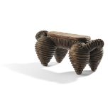 EXCEPTIONAL NORTH NGUNI HEADREST carved wood, evoking the shape of an animal, standing on four