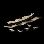 COLLECTION OF INUIT MARINE IVORY ANIMALS AND FISH GAMING COUNTERS comprising fourteen fish gaming