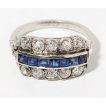 A sapphire and diamond set ringchannel set with a central row of square cut sapphires, between two