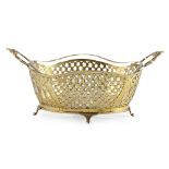 A continental silver gilt basketpossibly Viennese, of shaped oval form, pierced trellis design to