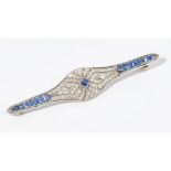 A sapphire and diamond bar broochmillegrain set with a square cut sapphire, in a tapering surround