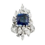 A sapphire doublet and diamond set cocktail ringclaw set with a cushion cut sapphire doublet, in