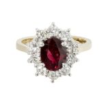 A ruby and diamond set cluster ringclaw set with an oval cut ruby, in a single border of round