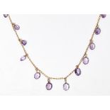 A 9ct gold amethyst set necklacecomposed of plain curb links, suspending at intervals fifteen