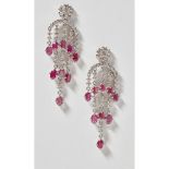 A pair of diamond ruby pendant earringseach claw set with a cluster of round brilliant cut diamonds,