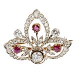 An mid-20th century ruby and diamond set broochof pierced foliate design, millegrain set with