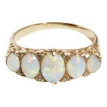 A Victorian opal and diamond set ringclaw set with five graduated oval opal cabochons with rose