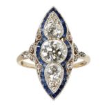 An early 20th century diamond and sapphire set cluster ringof navette shape, millegrain set with a