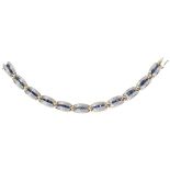 An 18ct white gold sapphire and diamond set braceletcomposed of eleven curved links each channel set