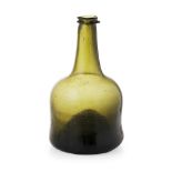 A GEORGIAN GREEN GLASS MALLET-SHAPED BOTTLE CIRCA 1740 of conventional dumpy form with moulded rim