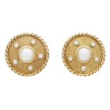 A pair of 18ct gold pearl and diamond set earringseach of circular outline, collet set with a