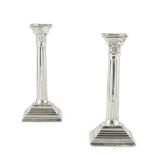 A pair of silver Corinthian column candlesticksMark of D.J. Silver, London, 1962, of conventional