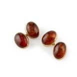 PAIR OF GENTLEMAN'S 9CT GOLD AMBER SET CUFFLINKS each oval terminal collet set with an amber