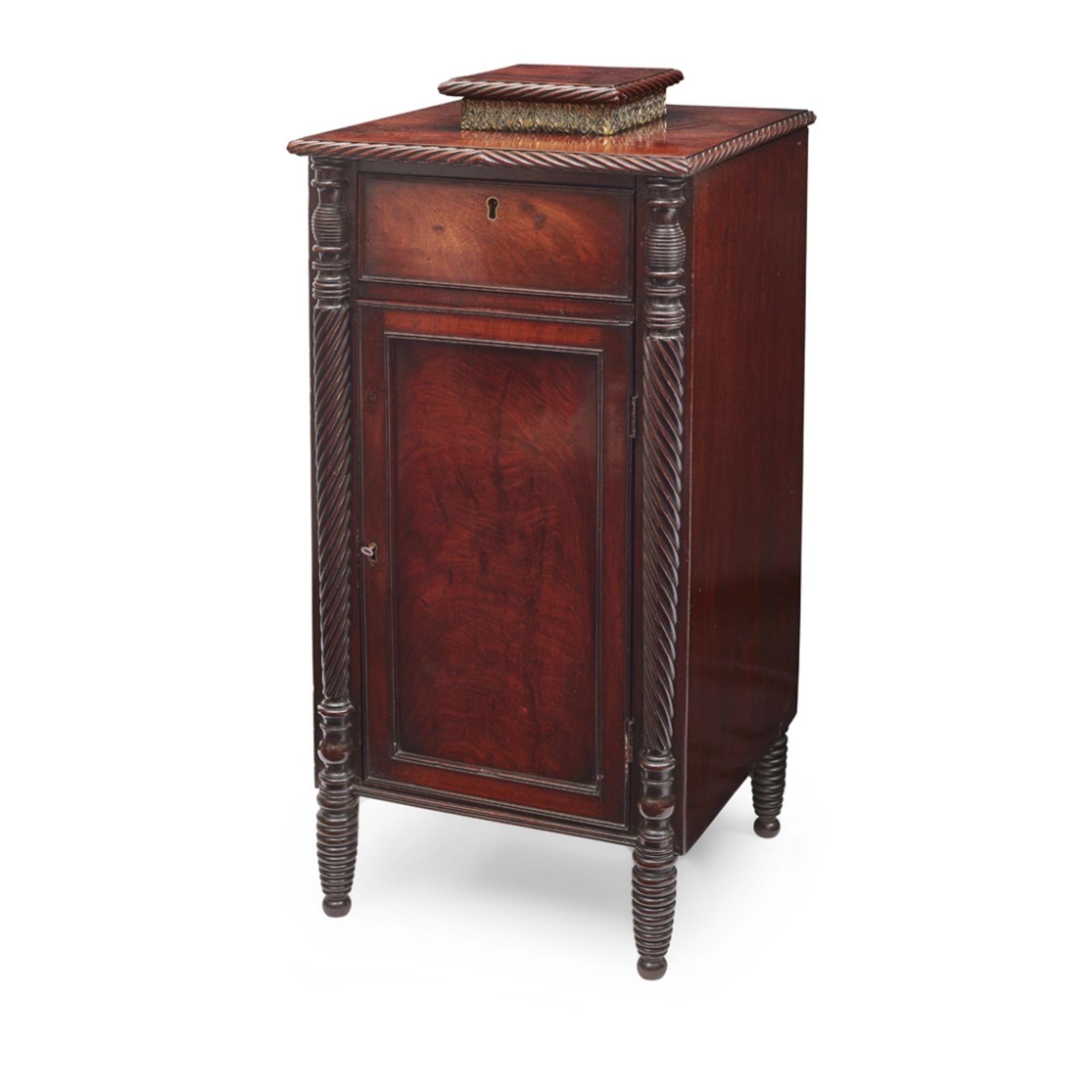 LATE REGENCY MAHOGANY CABINET EARLY 19TH CENTURY with a raised vase stand above the moulded top,