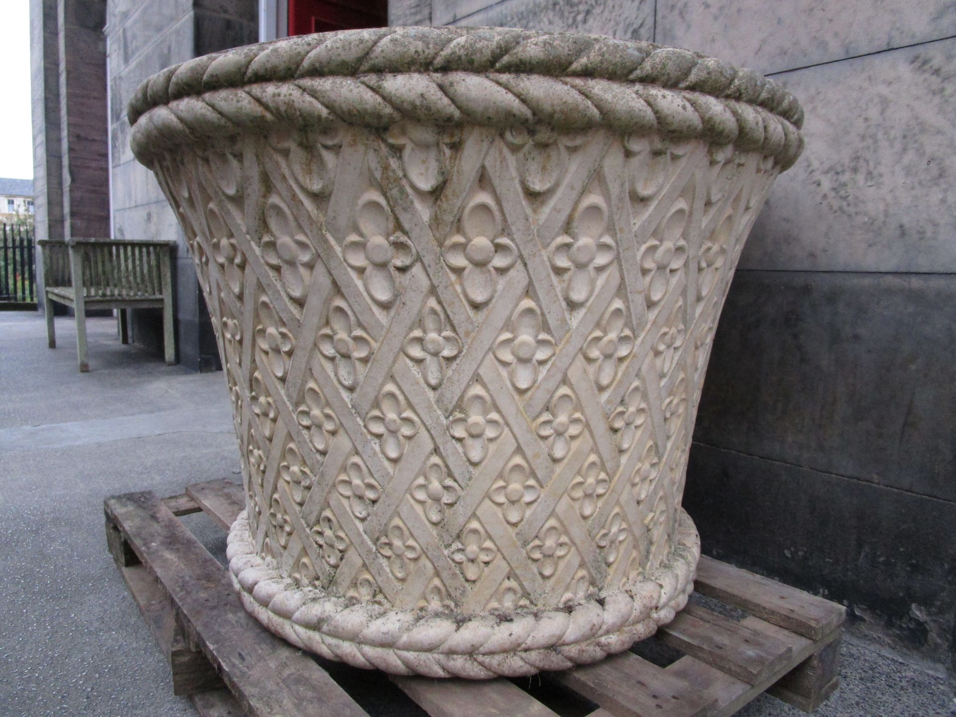 HADDONSTONE LTD., NORTHAMPTON LARGE STONE PLANTER, MODERN of slightly flared form, with rope-twist