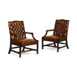 PAIR OF GEORGIAN STYLE LEATHER LIBRARY ARMCHAIRSMODERN in brown leather, the button-upholstered