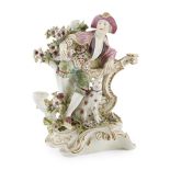 DERBY PORCELAIN FIGURE GROUPLATE 18TH CENTURY modelled as a young man seated against a balustrade,