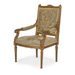 LOUIS XVI STYLE GILTWOOD AND NEEDLEWORK FAUTEUIL19TH CENTURY the square back with carved flower