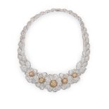 A yellow and colourless diamond parurecomprising necklace, earrings and brooch, the necklace