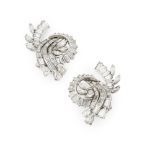 A pair of 1950s diamond set clip earringseach of stylised scrolling design, set throughout with