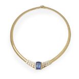 A contemporary Tanzanite and diamond set necklacebar set with a cushion cut Tanzanite, flanked to
