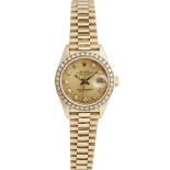 An 18ct gold and diamond set lady's wrist watch, RolexOyster Perpetual Datejust, ref. 69718,