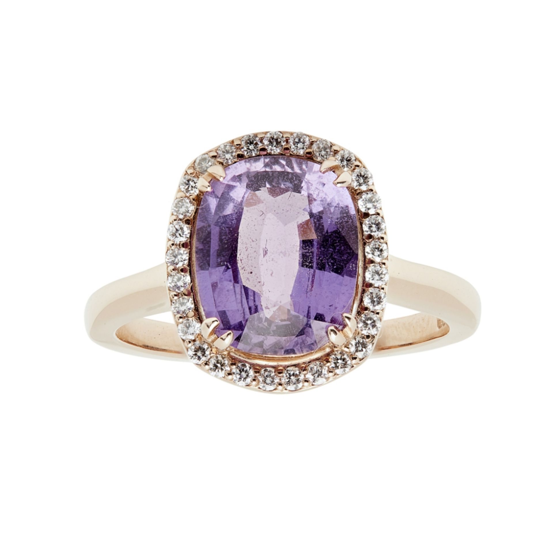 A purple colour-change sapphire and diamond cluster ringclaw set with a cushion cut purple colour-