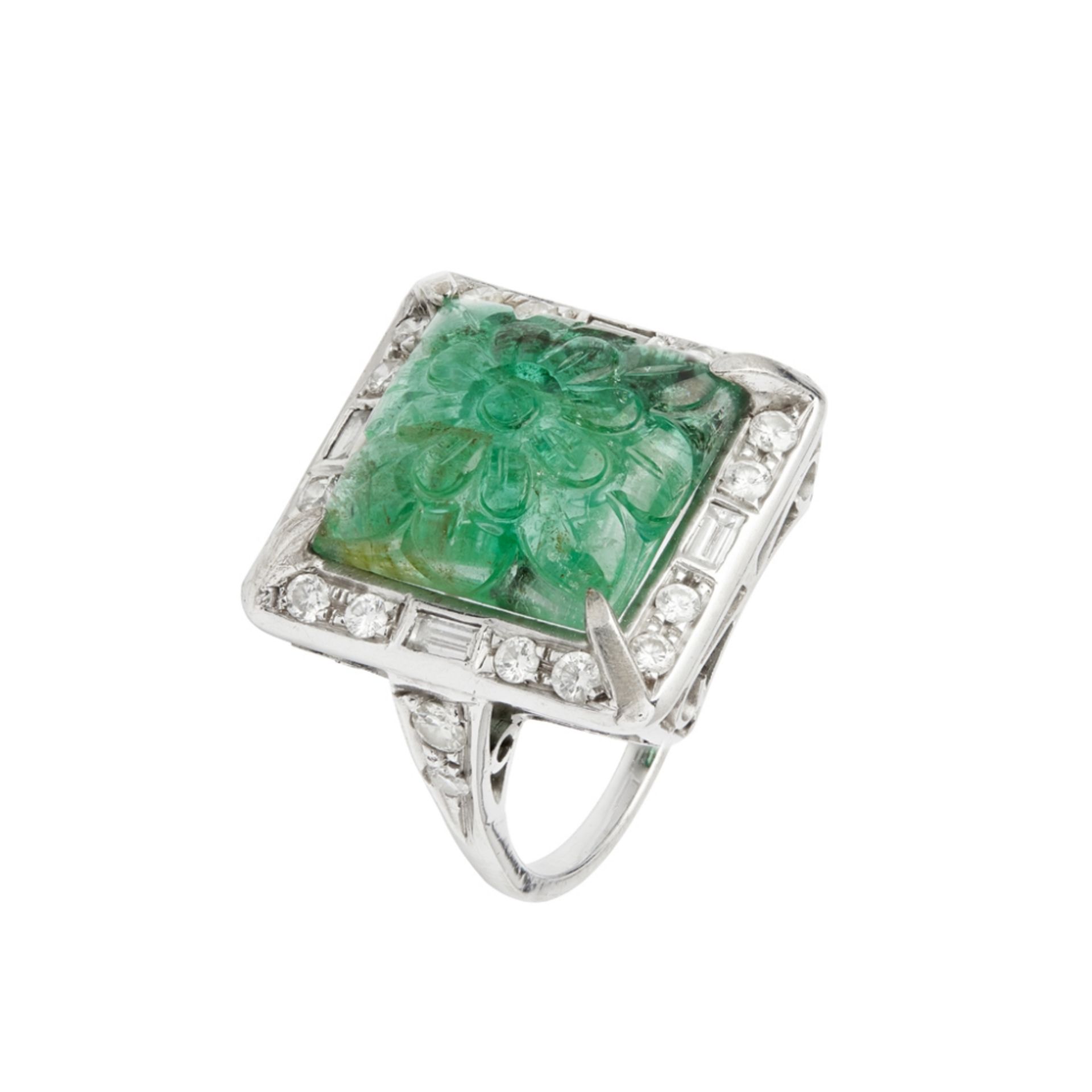 A carved emerald and diamond cluster ringclaw set with a carved square cabochon emerald, in a border