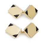 A pair of enamel and two-tone gentleman's cufflinkseach terminal of rectangular outline, one