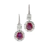 A pair of Burmese ruby and diamond set pendant earringseach claw set with an oval cut ruby in a