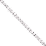 A diamond line braceletcomposed of 51 round brilliant cut diamonds, to a concealed clasp and