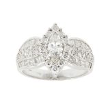 A diamond set cluster ringthe central claw set marquise cut diamond in a single border of twelve