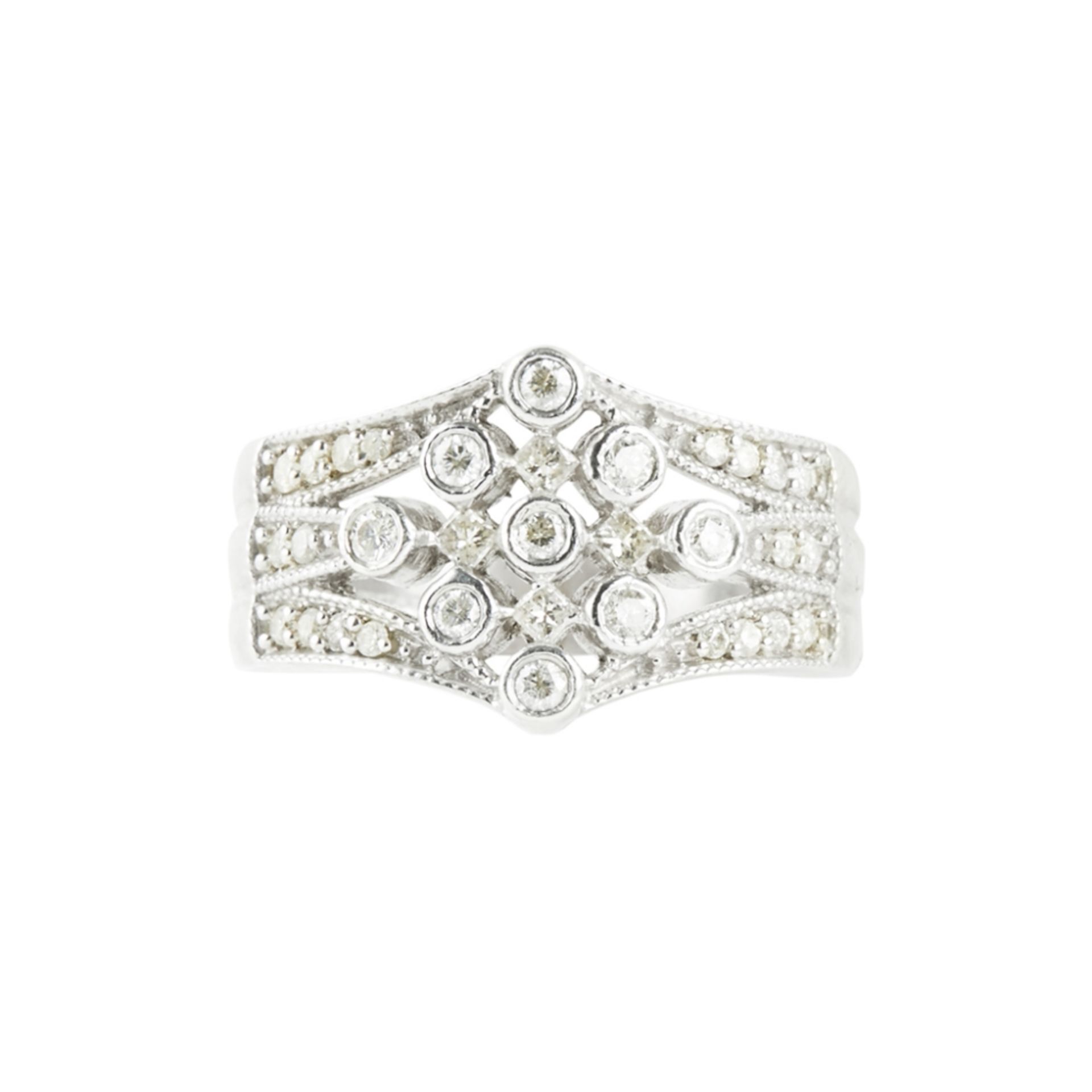 A diamond set ring the tapering pierced design set throughout with small round cut diamonds, to a