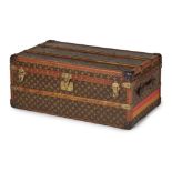 An early 20th century Louis Vuitton cabin trunk covered in signature monogram canvas with embossed